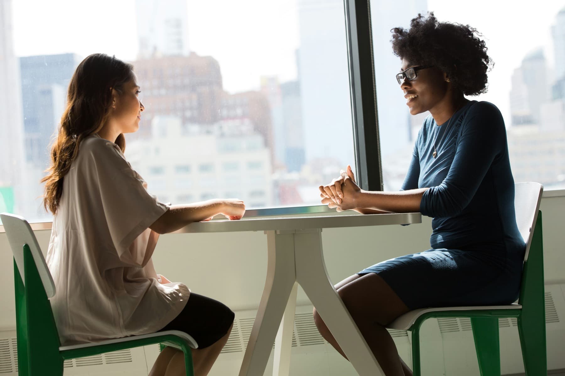 Two people in a 1:1 coaching conversation